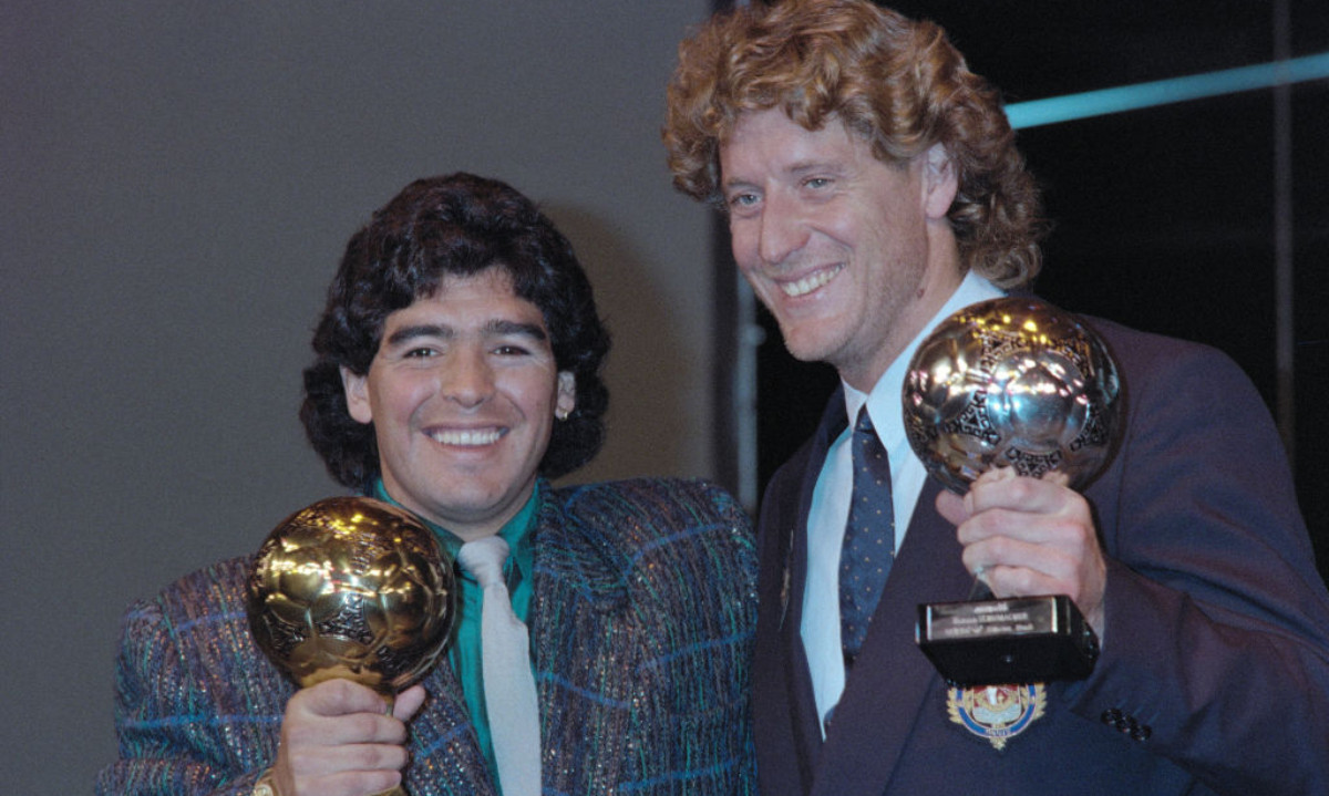 Maradona poses with the 1986 World Cup Ballon d'Or trophy alongside Harald Schumacher (Silver Ball) at the Lido in Paris on 13 November 1986. GETTY IMAGES
