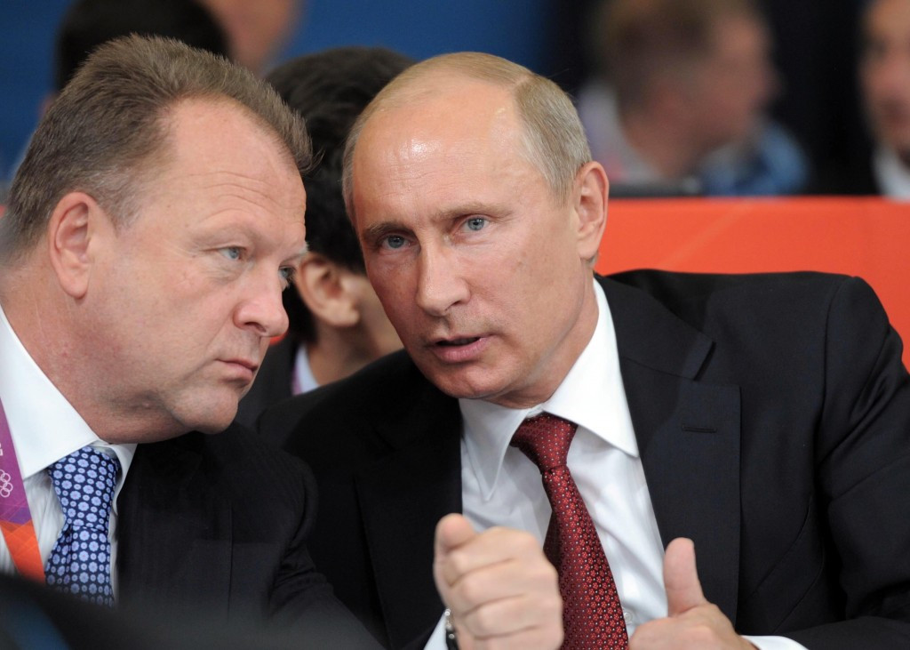 Marius Vizer (left) pictured with his long-term backer Vladimir Putin, has finally resigned as President of SportAccord ©AFP/Getty Images 