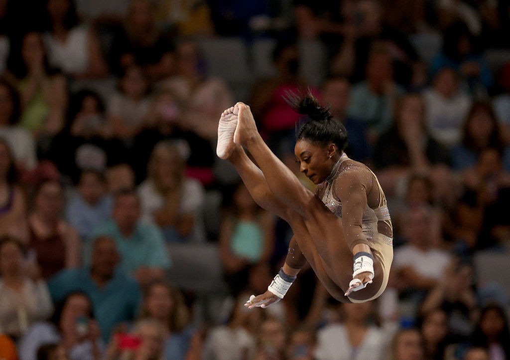 Simone Biles competes on the uneven bars during the 2024 Xfinity U.S. Gymnastics Championships. GETTY IMAGES