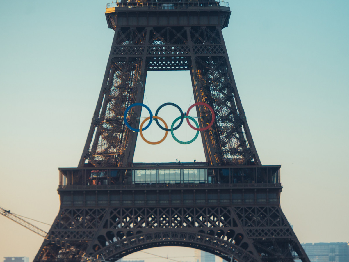 The rings have been raised onto the Eiffel Tower successfully. OLYMPICS.COM