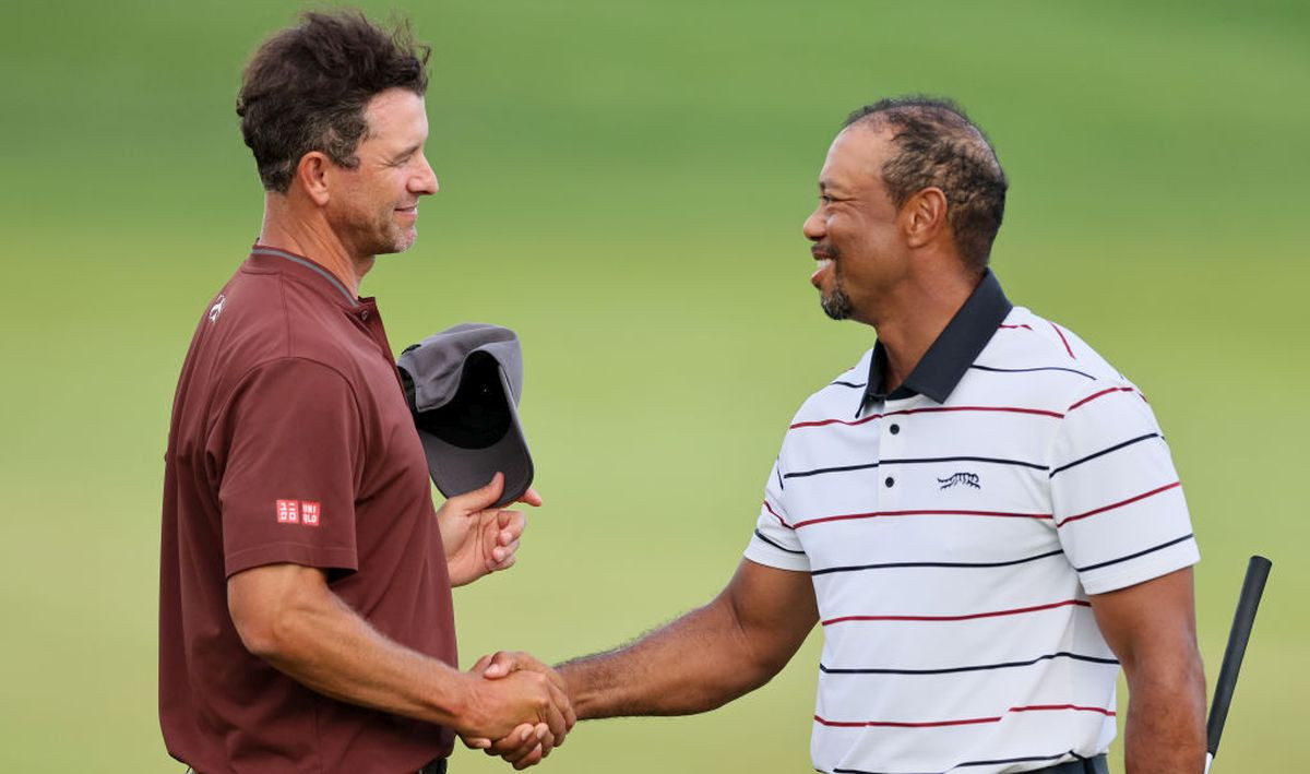 Adam Scott and Tiger Woods shake hands during the second round of the 2024 PGA Championship on 17 May 2024. GETTY IMAGES