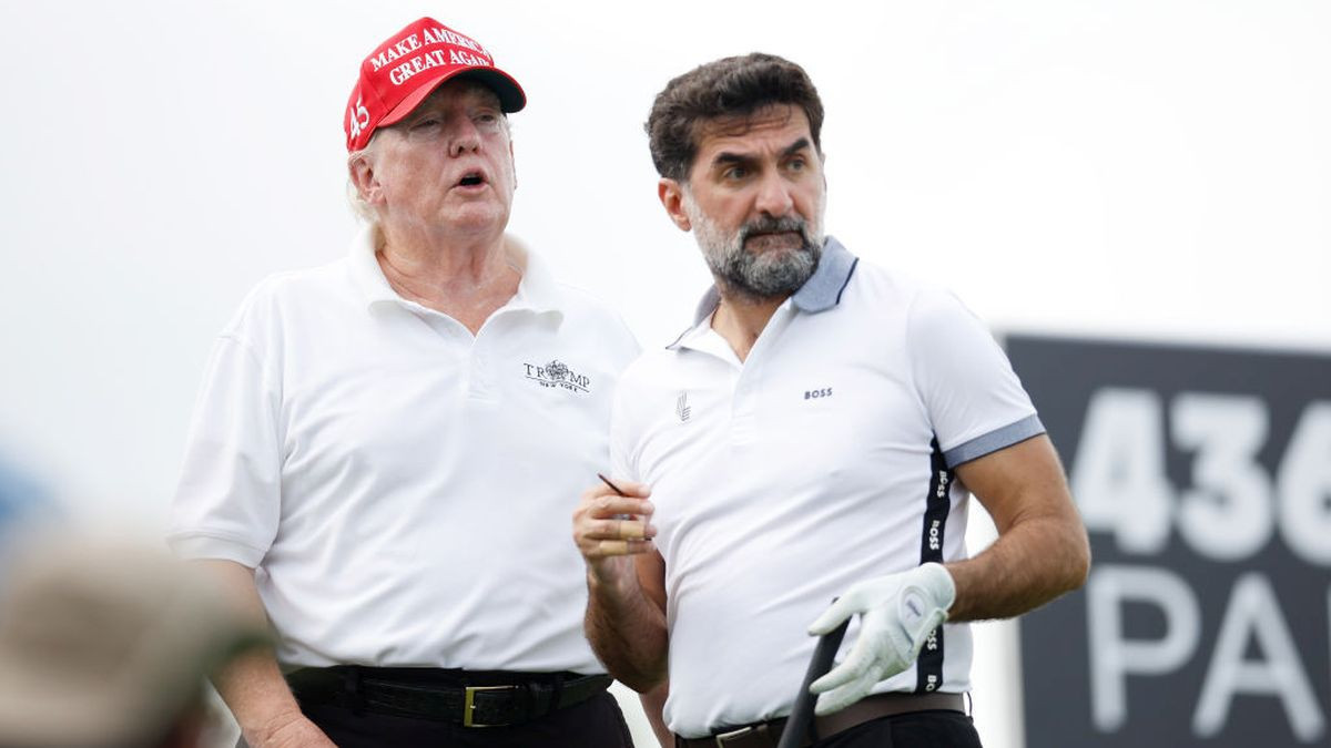 Former US President Donald Trump and Yasir al-Rumayyan during the pro-am prior to the LIV Golf Invitational in July 2022. GETTY IMAGES