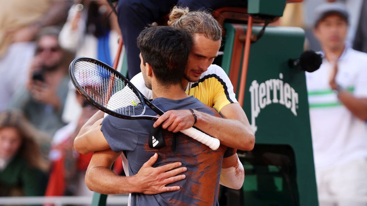 Carlos Alcaraz hugs Alexander Zverev after the Men's Singles Final match of the 2024 French Open on 09 June 2024. GETTY IMAGES