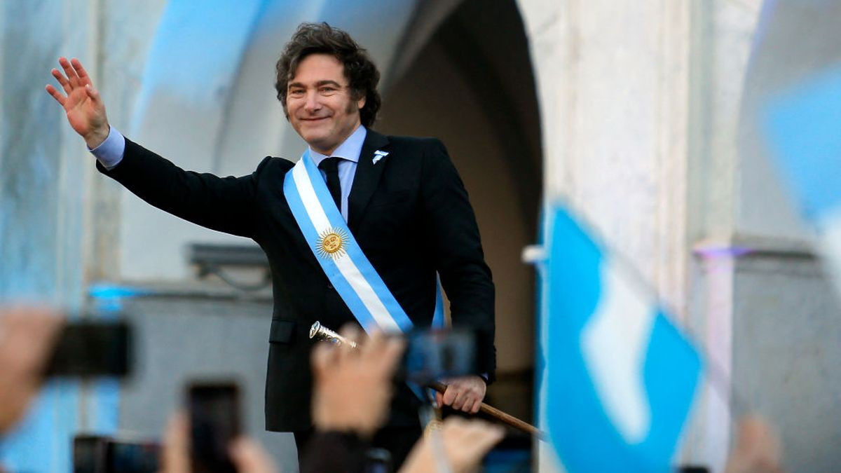 Argentina's President Javier Milei waves during the commemoration of the 214th anniversary of the May Revolution on 25 May 2024. GETTY IMAGES