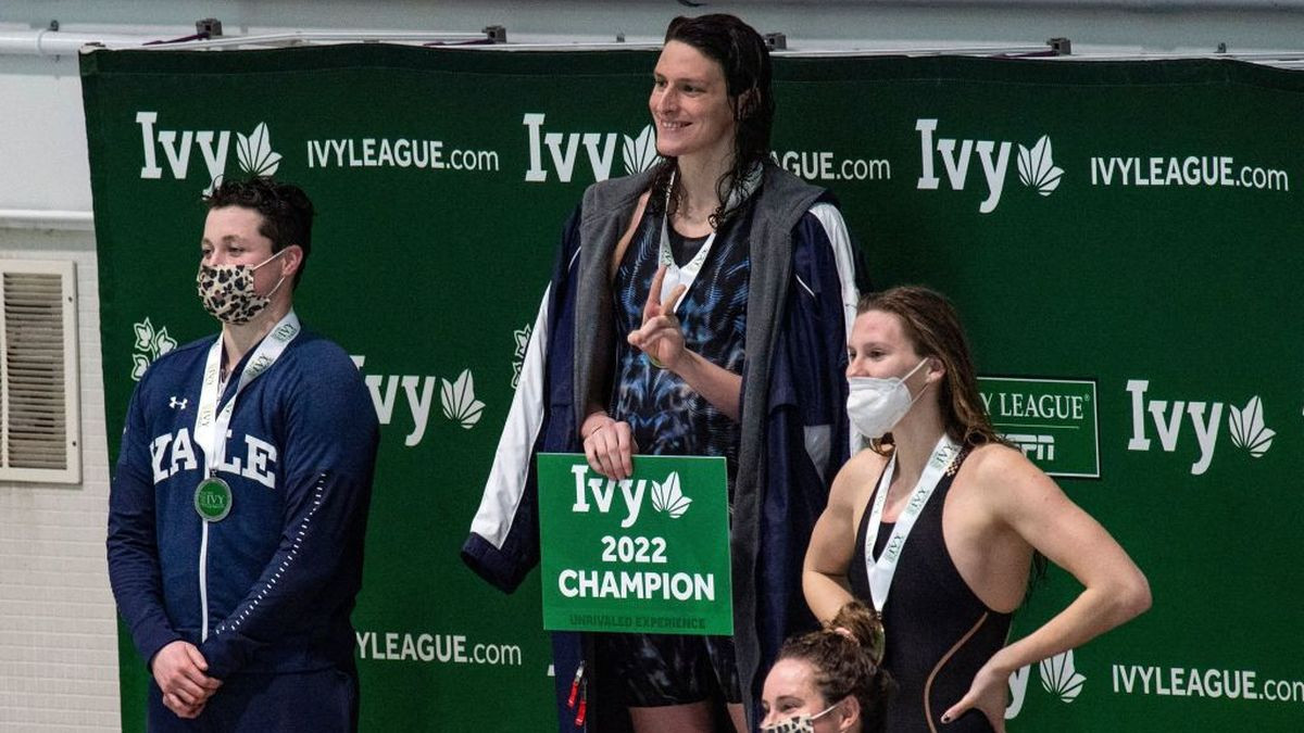 Transgender Lia Thomas (2nd L) of Penn University and transgender Iszac Henig (L) after placing first and second in the 100-yard freestyle swimming. GETTY IMAGES
