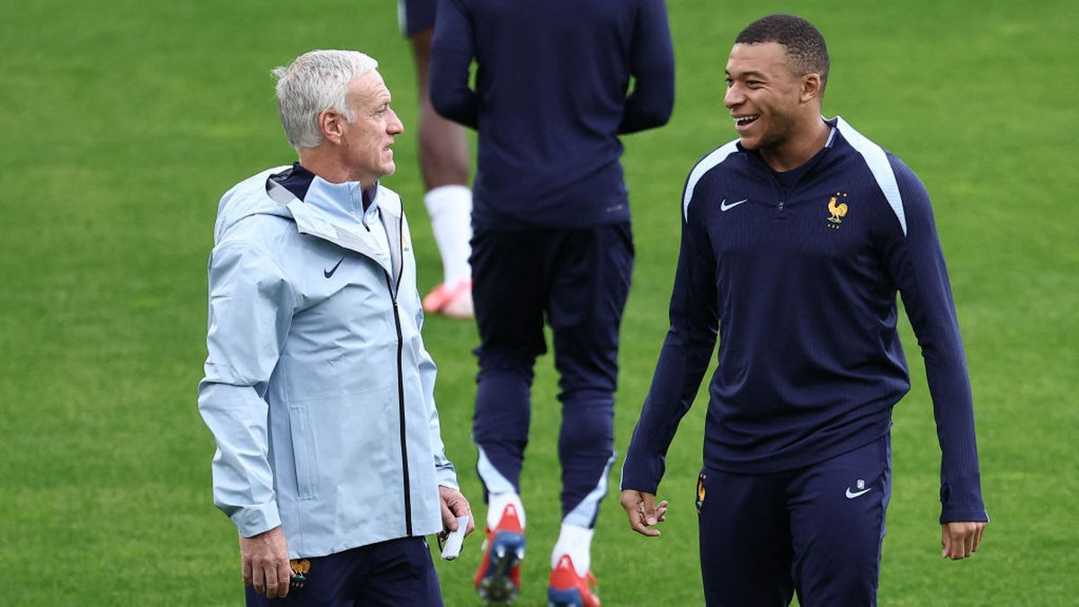 Kylian Mbappe speaks with France's head coach Didier Deschamps during an MD-1 training session at Paul Janes Stadium in Duesseldorf on 16 June 2024. GETTY IMAGES