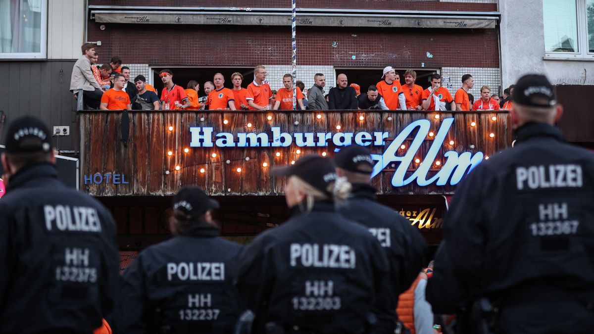 Holland supporters and German police officers on Hamburg's famous Reeperbahn. GETTY IMAGES