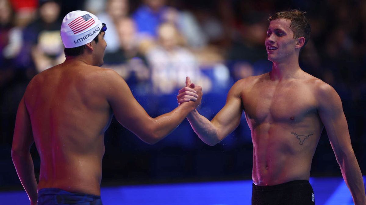 Jay Litherland congratulates Carson Foster in the 2024 U.S. Olympic Team Swimming Trials at Lucas Oil Stadium on 16 June 2024 in Indianapolis. GETTY IMAGES