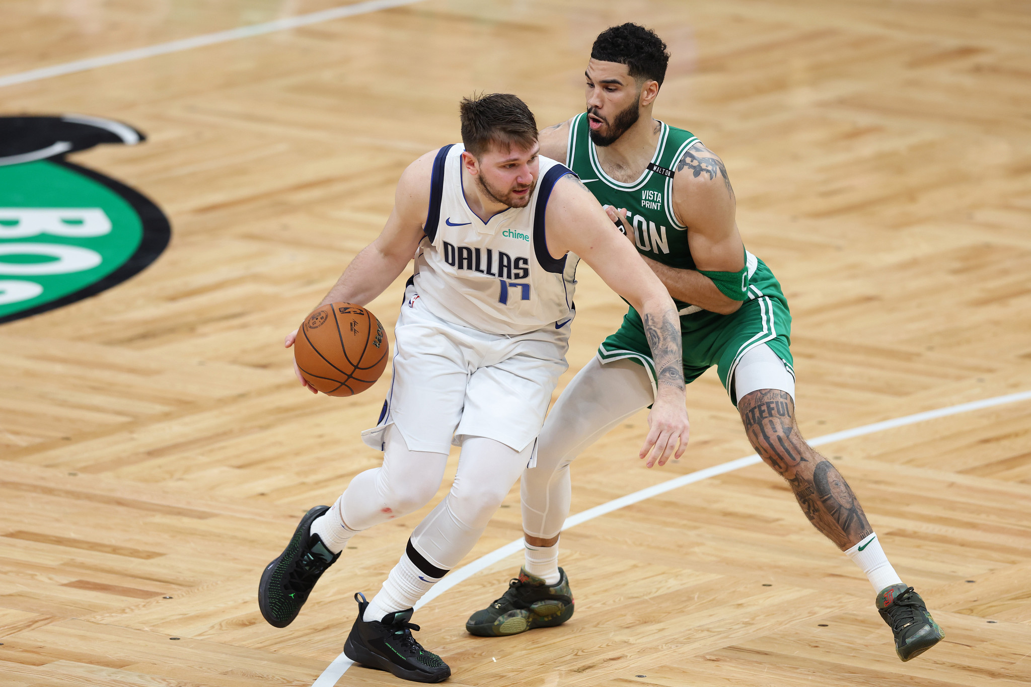Luka Doncic drives against Jayson Tatum. GETTY IMAGES