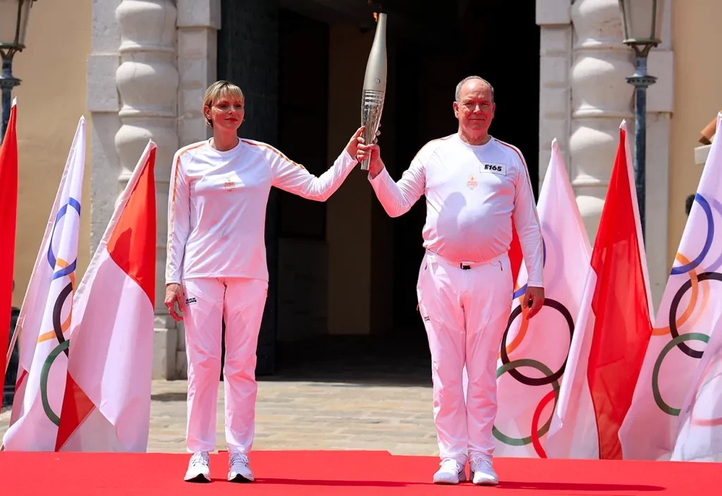 Monaco’s Prince Albert II (R) and Princess Charlene of Monaco (L) held the Torch in Monaco. GETTY IMAGES