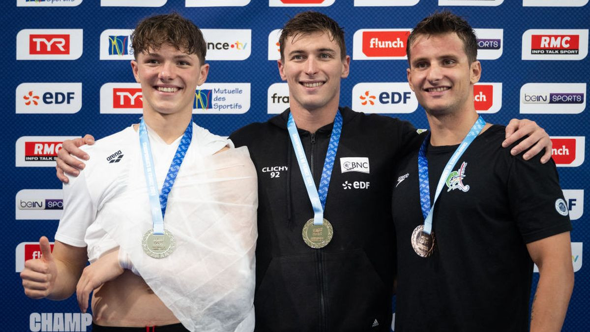 (From L to R) Fente Damers (2nd placed), Grousset (1st placed) and Salvan (3rd placed) celebrate on the podium following the men's 100m freestyle. GETTY IMAGES
