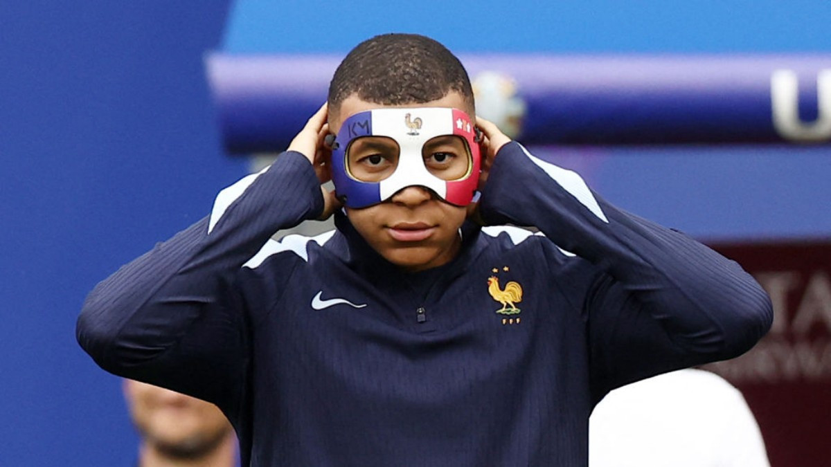 Mbappe sports the tricolour mask, but if he plays against the Netherlands, he will have to use a different one to comply with the regulations. GETTY IMAGES