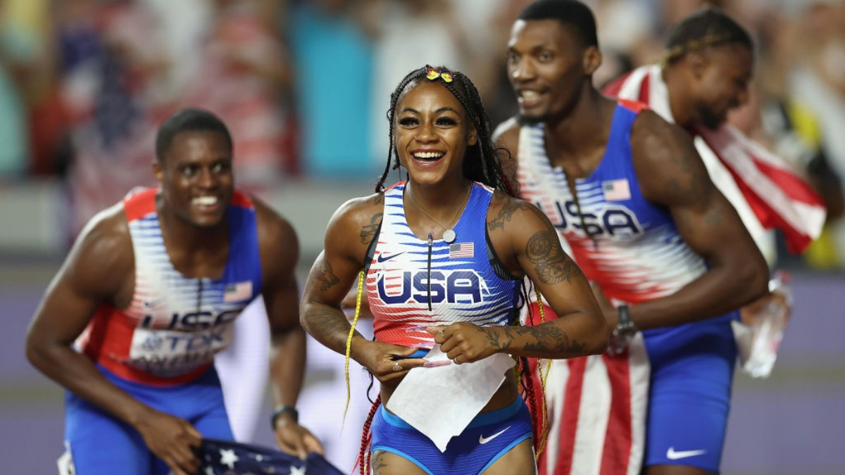 Richardson is congratulated after winning gold in the 4x100m at Budapest 2023. GETTY IMAGES