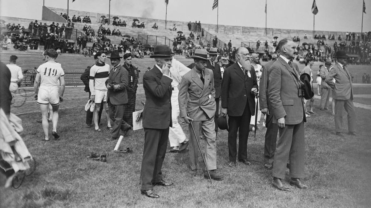 Pierre de Coubertin on the infield with athletes and officials during the 1924 Games joined by Edward, Prince of Wales, and former athlete Justinien de Clary. GETTY IMAGES
