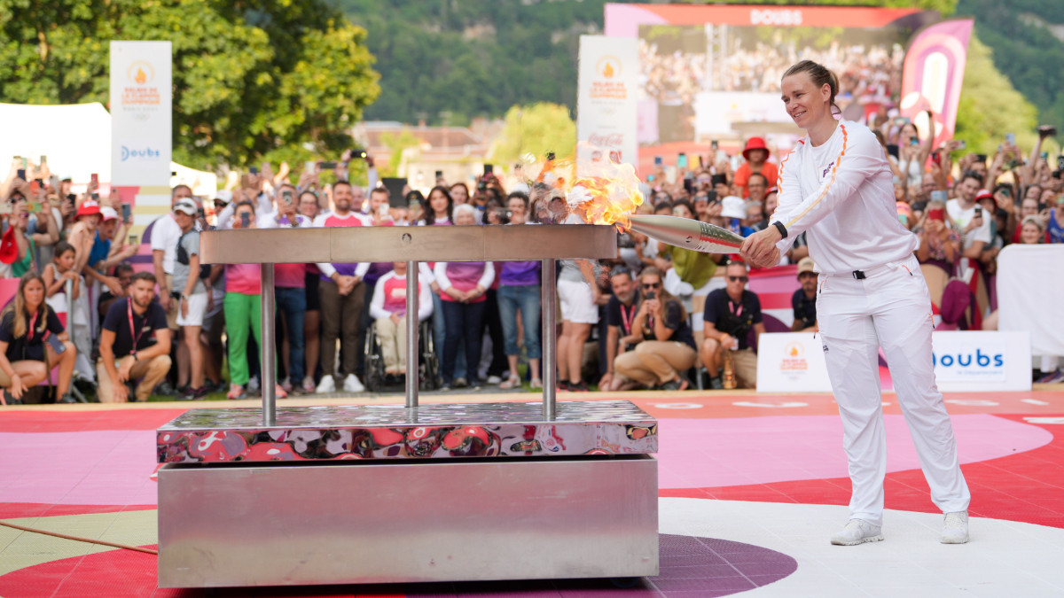Biathlete Anaïs Bescons lit the celebration cauldron in Besançon. PARIS 2024