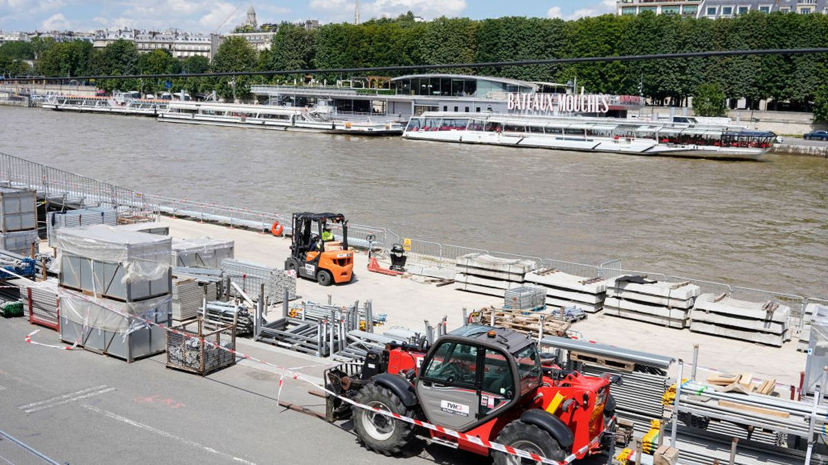 Grandstands are set up on the banks of the Seine river in Paris on 24 June 2024, a few weeks before the Olympic Games. GETTY IMAGES