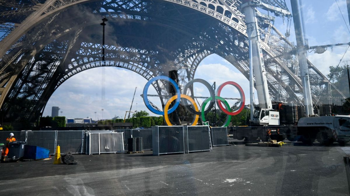 Workers installing the rings that will hang from the Eiffel Tower, in Paris on June 2024.GETTY IMAGES

