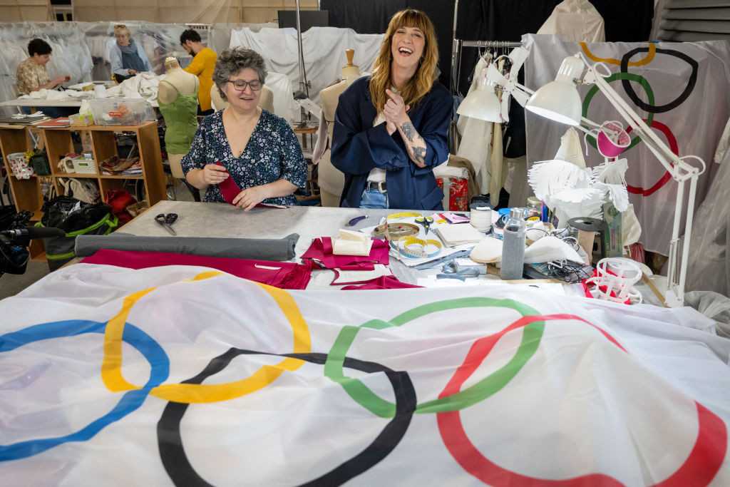 Director of Costumes for Paris 2024 Daphne Burki poses next to a seamstress. GETTY IMAGES