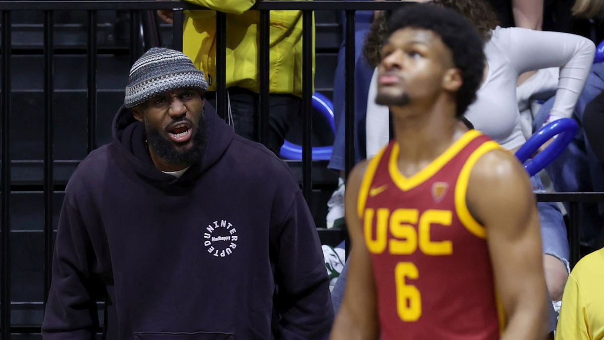 LeBron cheering on his son at a college game last year. GETTY IMAGES