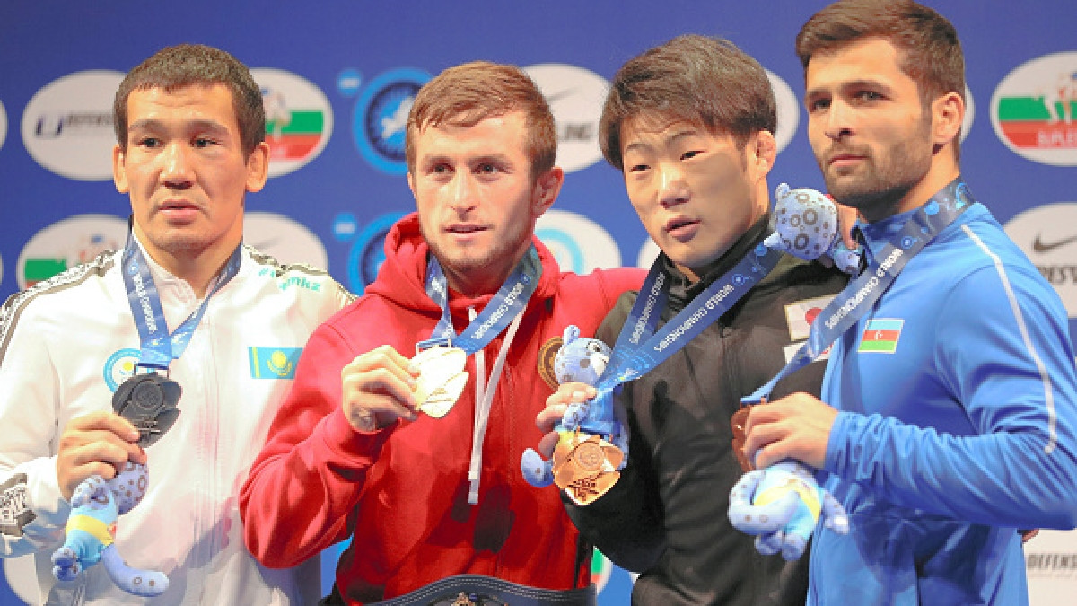 Tsurtsumia (second from left) with the gold medal of the 2019 World Championship. GETTY IMAGES