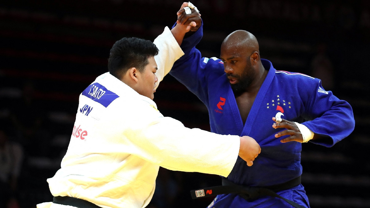 French judo living legend eddy Riner (blue) is Saito's biggest rival at Paris 2024. GETTY IMAGES