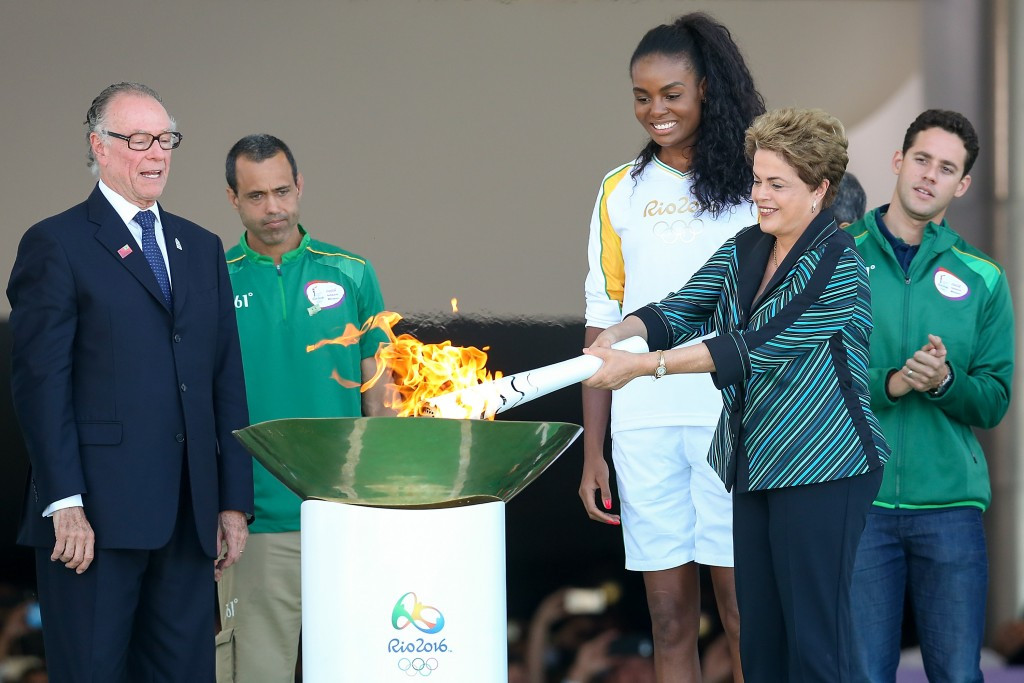 The Olympic Flame is rekindled by Brazilian President Dilma Rousseff ©Getty Images