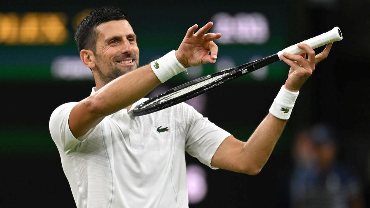 Novak Djokovic of Serbia celebrates winning match point with a violin gesture at All England Lawn Tennis and Croquet Club on July 2024. GETTY IMAGES