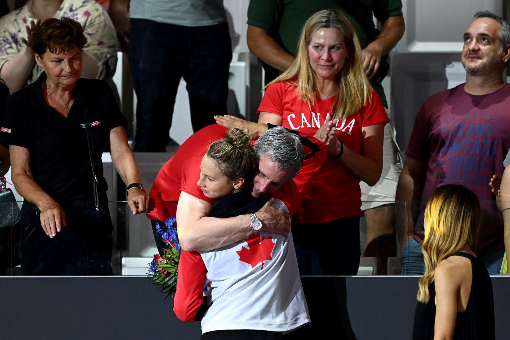 Gold medalist Summer McIntosh celebrates with family members after the Women's 400m Individual Medley at the 2022 FINA World Championships. GETTY IMAGES