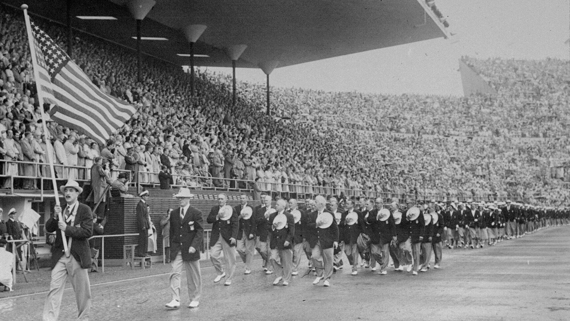 The United States delegation depilates in the Olympic stadium during the opening of the Olympic Games in Helsinki, Finland, on July 19, 1952. AP PHOTO.