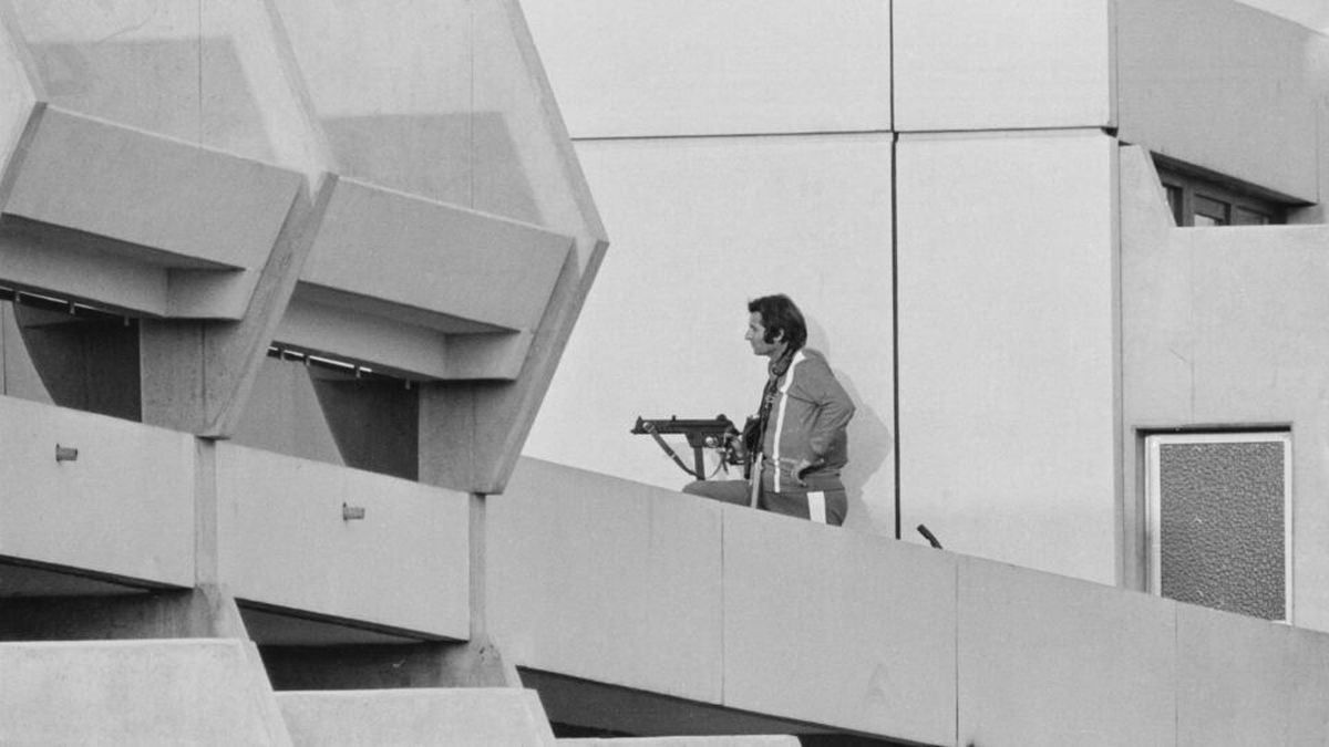 The iconic image of one of the terrorists, leaning out from a balcony of the 1972 Munich Olympic Village. GETTY IMAGES.
