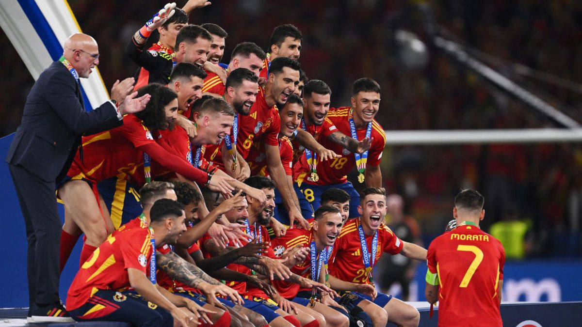 Alvaro Morata of Spain walks the UEFA Euro 2024 Henri Delaunay Trophy to the winners stage as players of Spain react after the UEFA EURO 2024. GETTY IMAGES