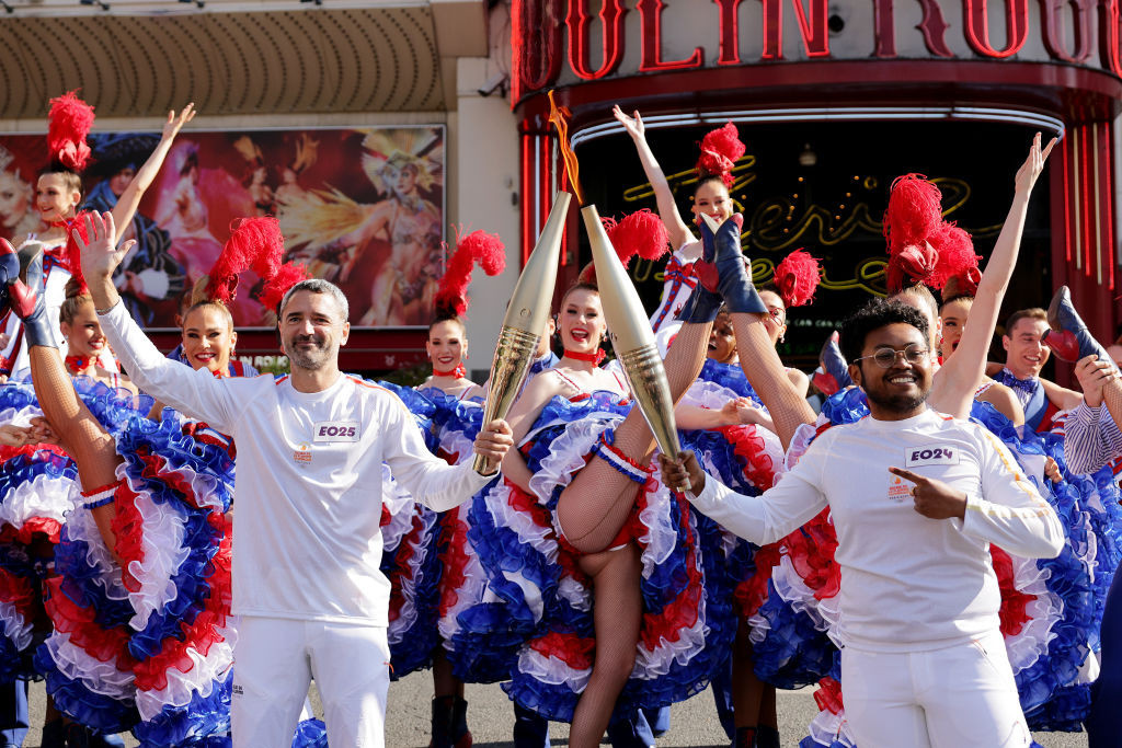 The Olympic torch passed through the iconic Moulin Rouge. GETTY IMAGES