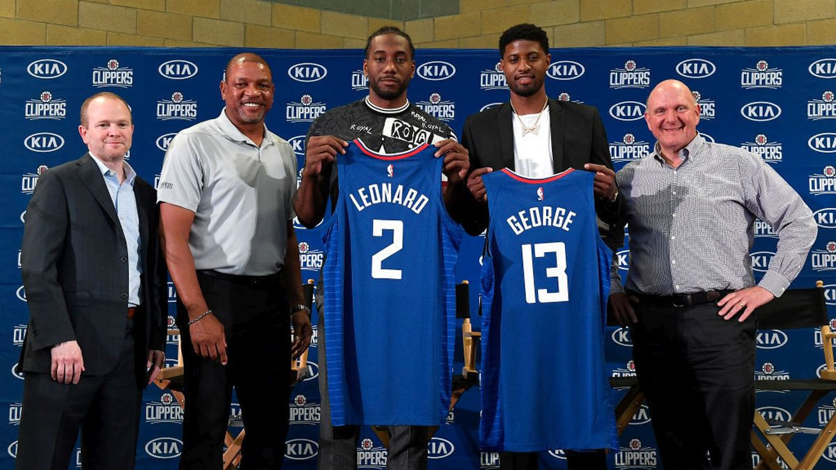 President of Basketball Operations Lawrence Frank, head coach Doc Rivers, Paul George, Kawhi Leonard and owner Steve Ballmer of the Los Angeles Clippers attend the Paul George and Kawhi Leonard introductory press conference. GETTY IMAGES.