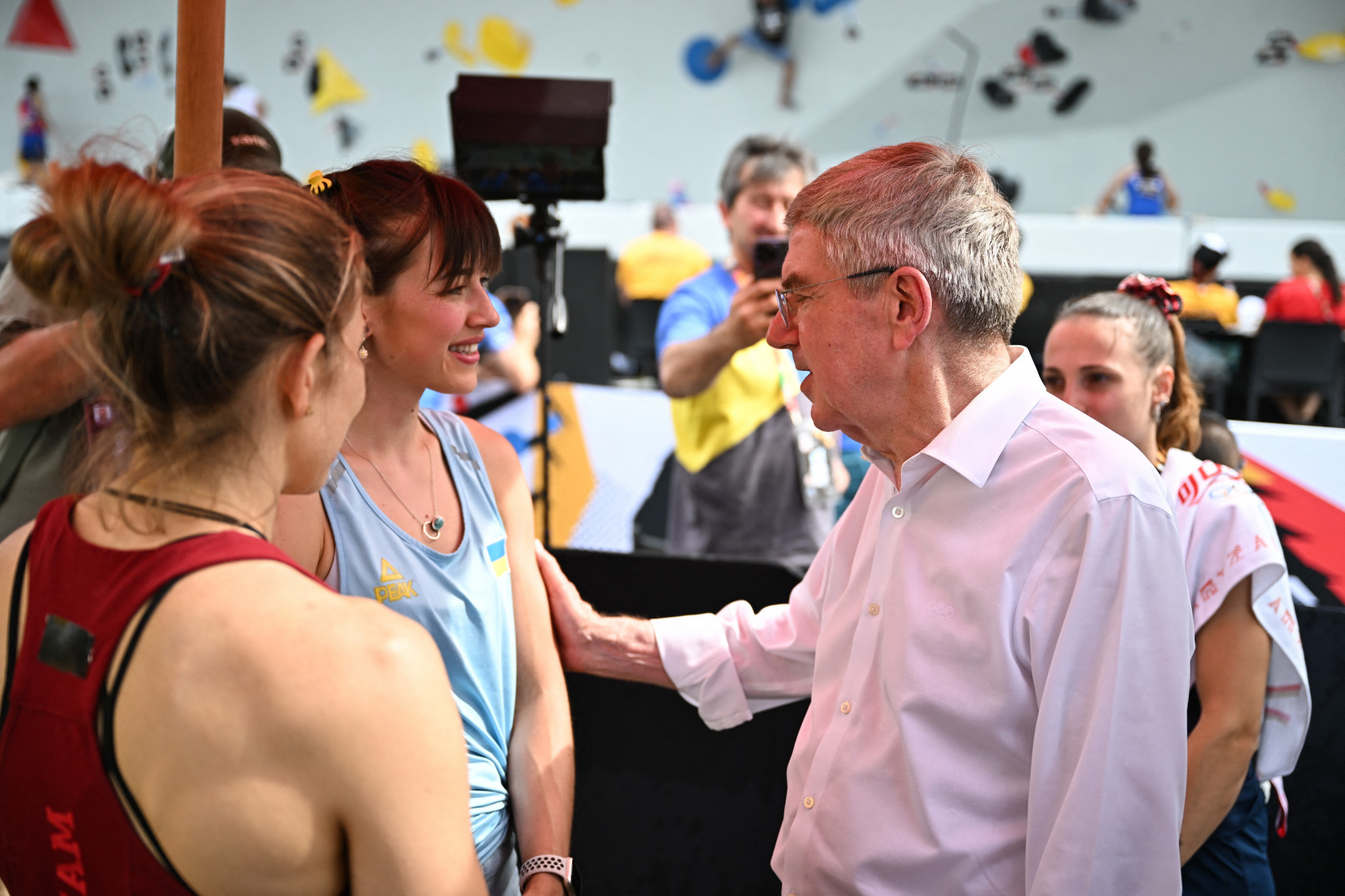 The 27-year-old, being greeted by IOC President Thomas Bach, will compete in the boulder and lead events in Paris. GETTY IMAGES