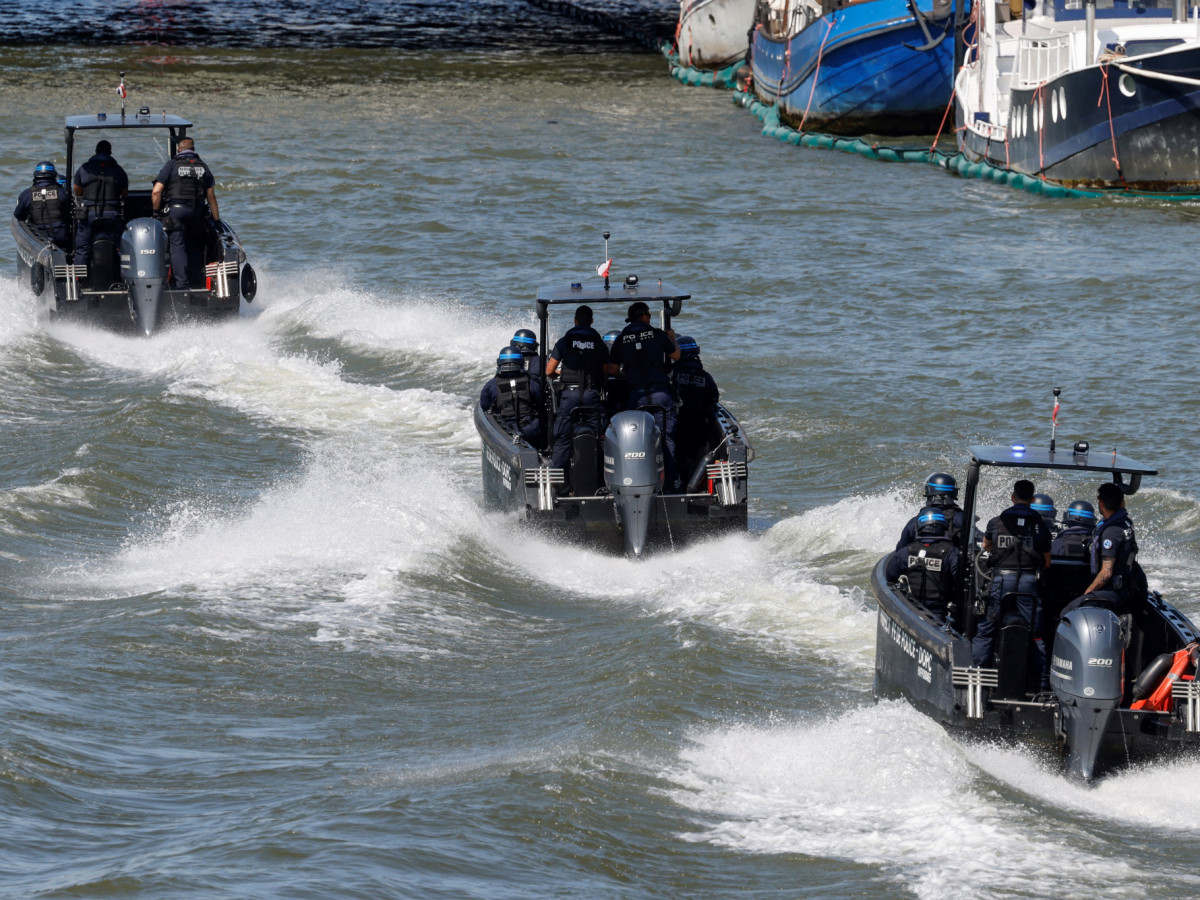 French police officers ride speedboats on the Seine River in Paris. GETTY IMAGES