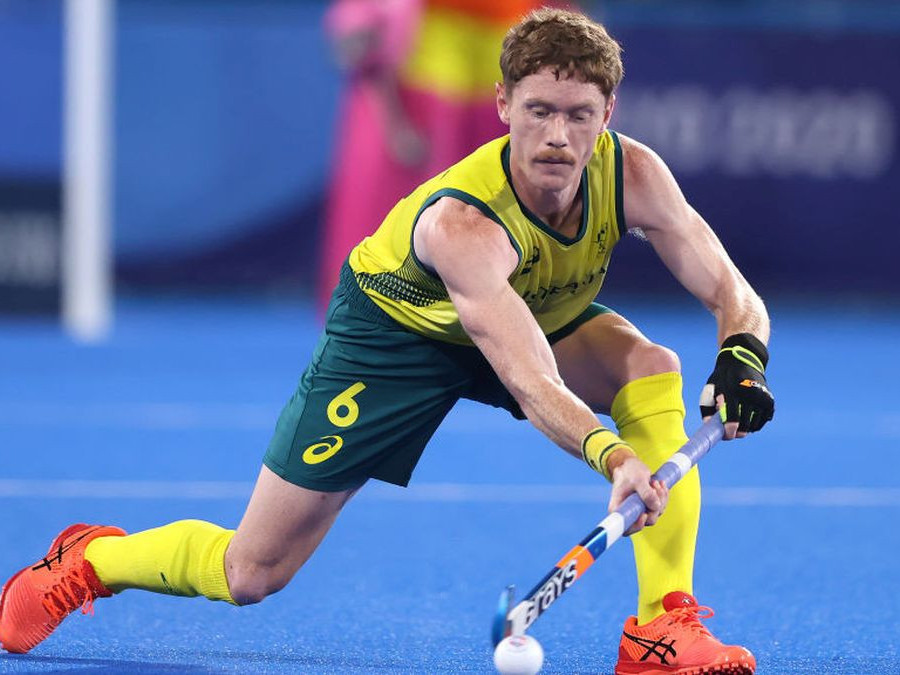 Matthew Dawson of Team Australia passes the ball during the Men's Gold Medal match between Australia and Belgium. GETTY IMAGES.