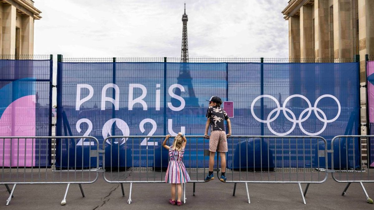 Children stand next to the entrance to Place du Trocadero with the Eiffel Tower in view in Paris. GETTY IMAGES
