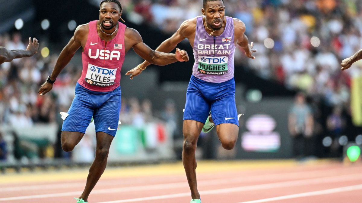Noah Lyles and Zharnel Hughes compete in the middle of the 100 metres sprint. GETTY IMAGES