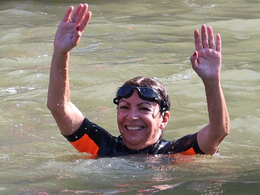 Paris Mayor Anne Hidalgo swims in the Seine River to demonstrate that the river is clean enough. GETTY IMAGES