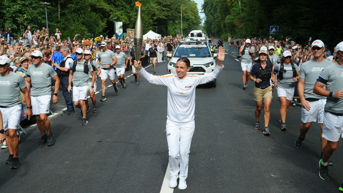 Iconic football referee Stéphanie Frappart carries the Olympic Torch. PARIS 2024