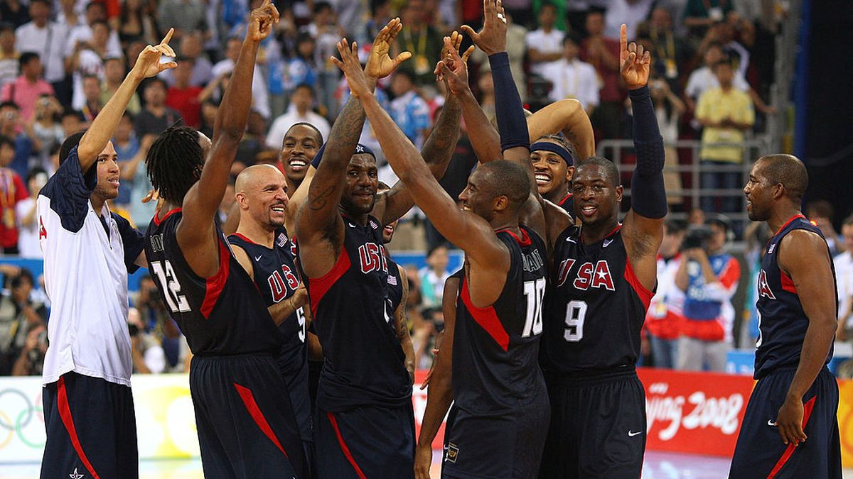 Team USA huddles at center court after winning the gold medal game in 2008. GETTY IMAGES