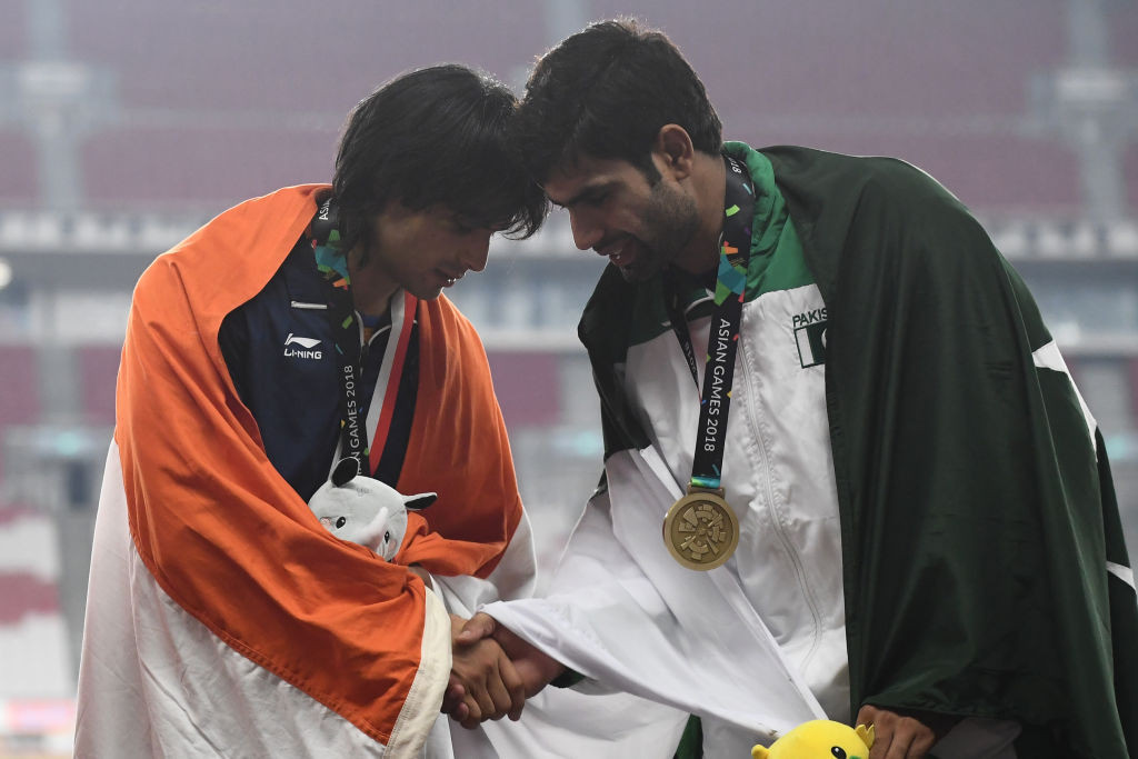 India's Neeraj Chopra shakes hands with Pakistan's Arshad Nadeem during the Asian Games. GETTY IMAGES