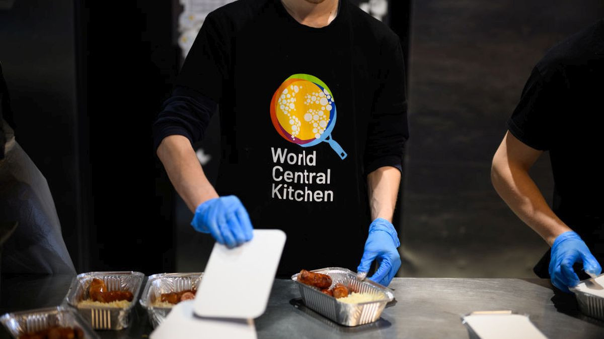 Chefs and volunteers at World Central Kitchen prepare and package warm meals to be distributed. GETTY IMAGES