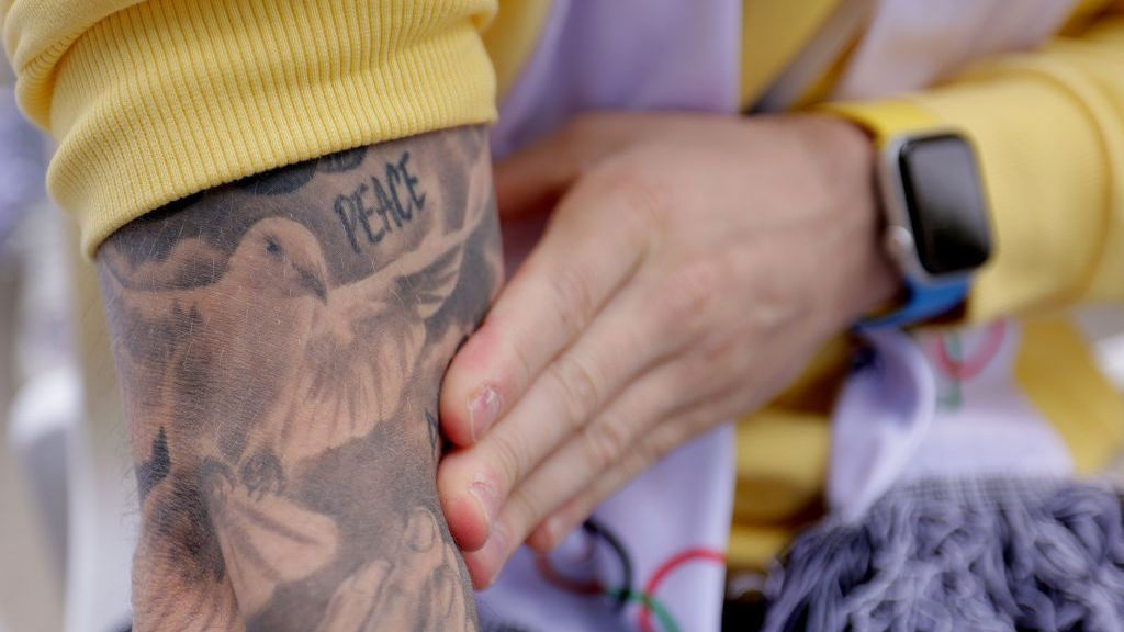 A detailed view of a tattoo on the arm of Oleg Verniaiev of Team Ukraine during the Athletes' Call for Peace at the Olympic Village Plaza. GETTY IMAGES