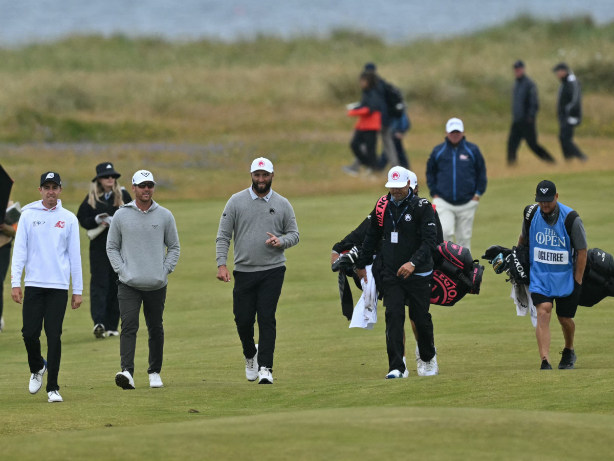 David Puig and Jon Rahm walking during a practice round ahead of the 152nd British Open Golf Championship in Scotland in July. GETTY IMAGES