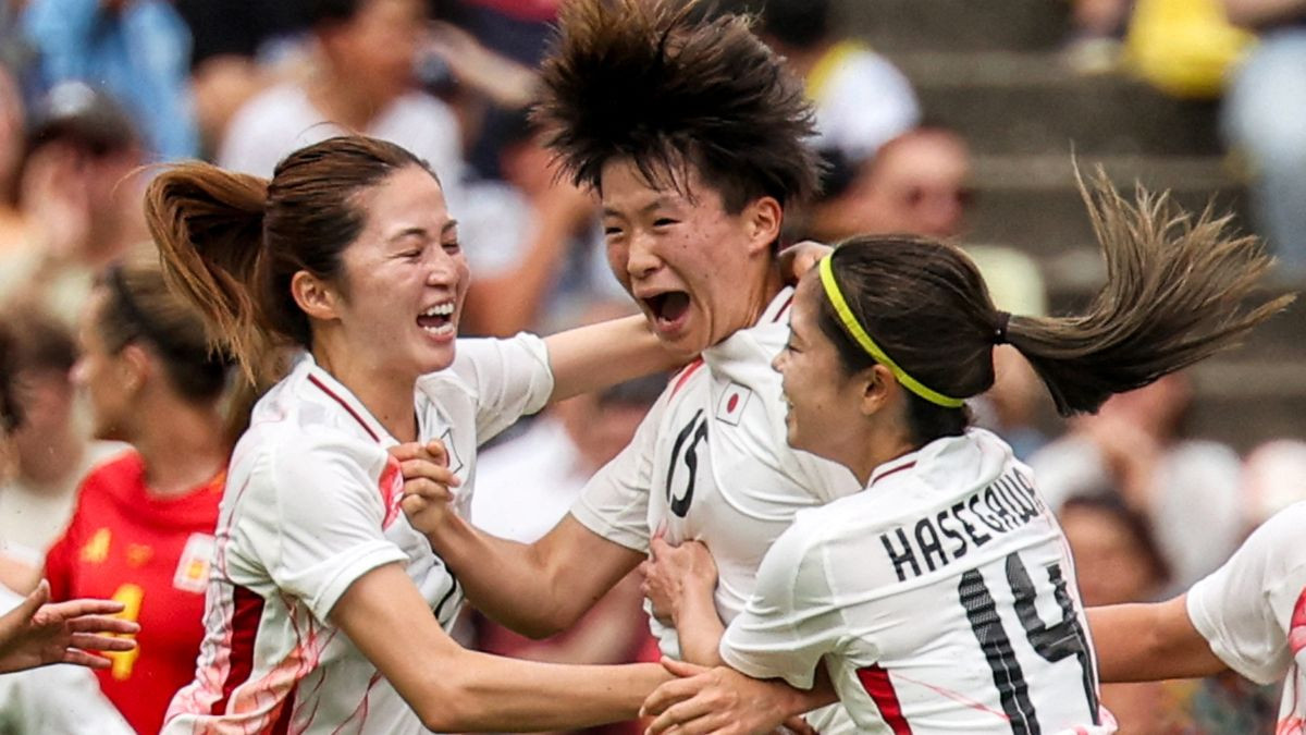Aoba Fujino celebrates with teammates after scoring her team's first goal. GETTY IMAGES