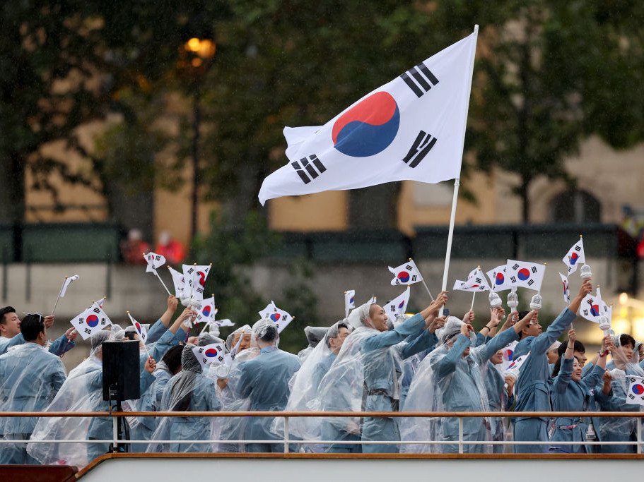 The South Korean delegation was incorrectly introduced as North Korea as they sailed down the Seine. GETTY IMAGES