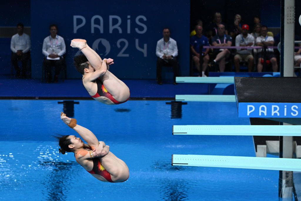 Chang Yani and Chen Yiwen compete in the women's synchronised 3m springboard final. GETTY IMAGES