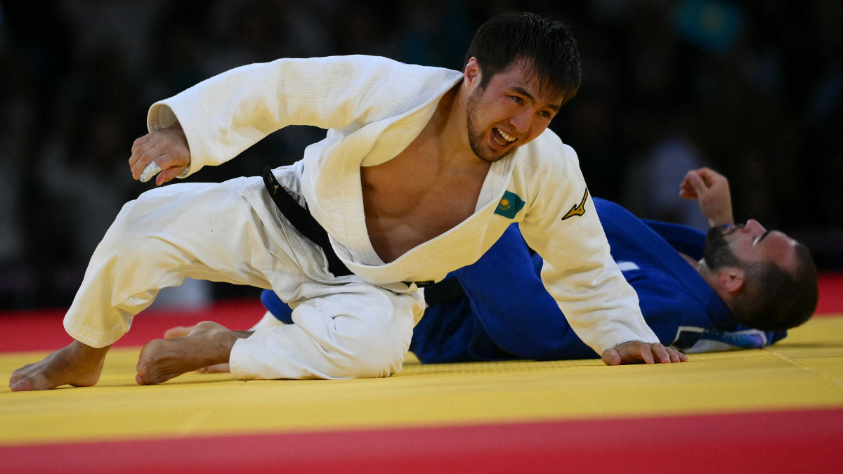Kazakhstan's Yeldos Smetov seconds after winning his final bout against France's Luka Mkheidze. GETTY IMAGES