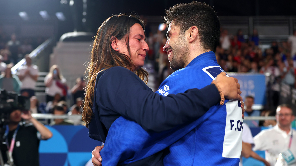 Fransisco Garrigos celebrates with his partner after securing bronze. GETTY IMAGES